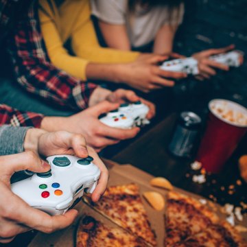 young people teenagers playing video games consoles vpn services xbox popcorn